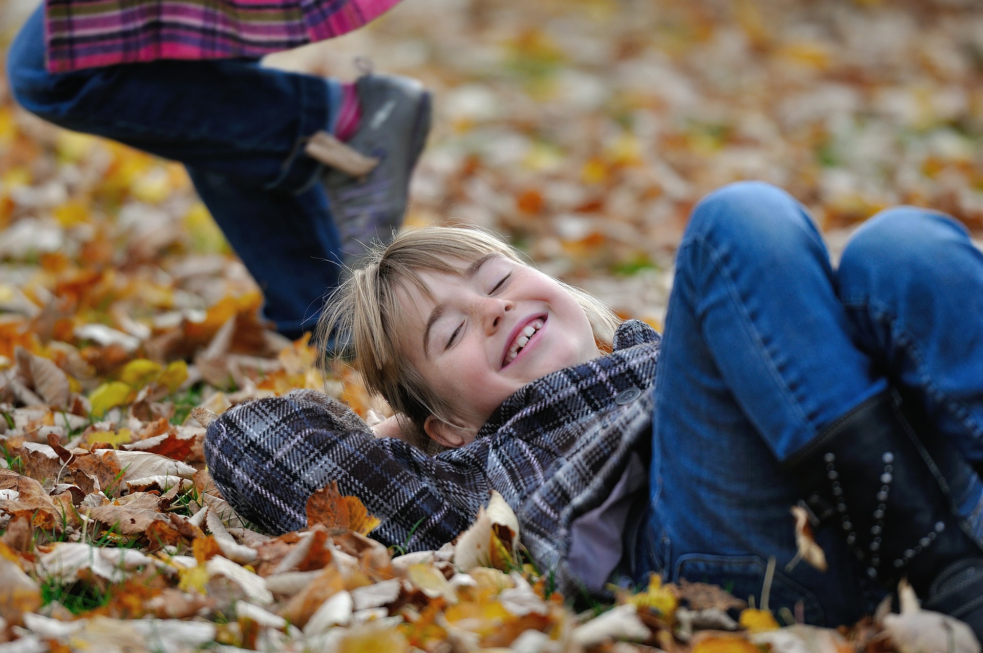children and autumn leaves